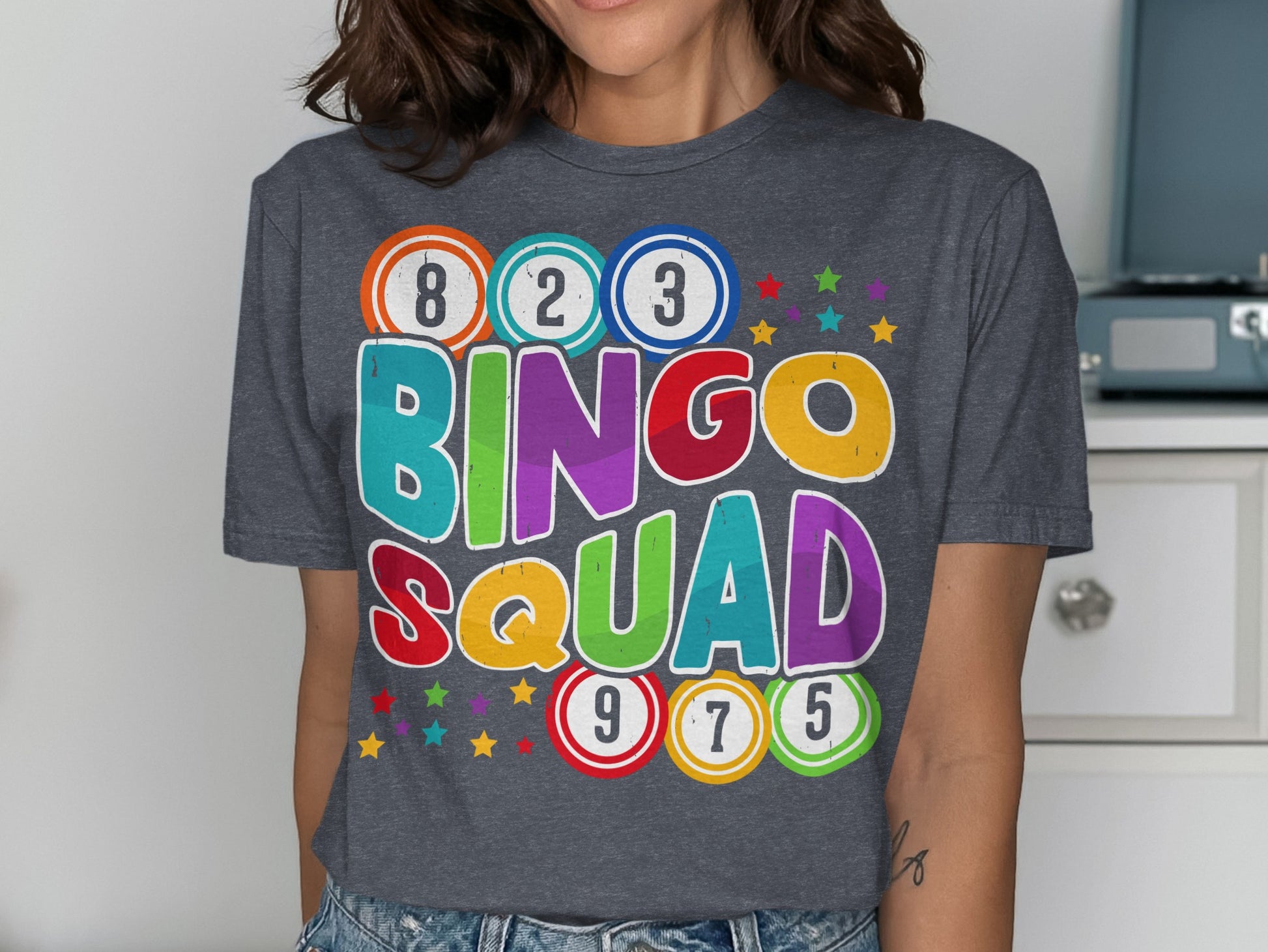 T-shirt with "BINGO SQUAD" in colorful letters and bingo balls.