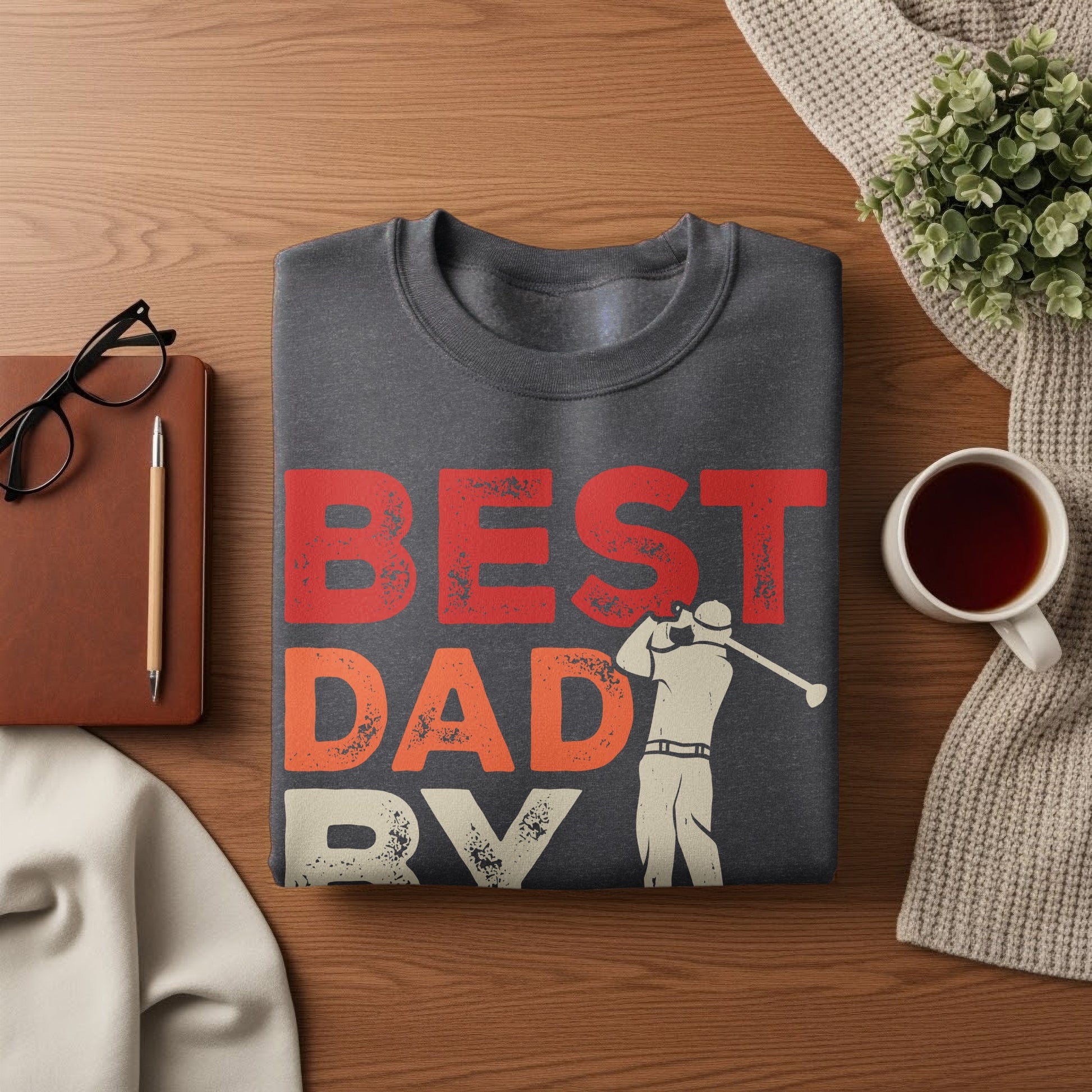 Dark gray sweatshirt with "BEST DAD EVER" in red and white with a golfer graphic.