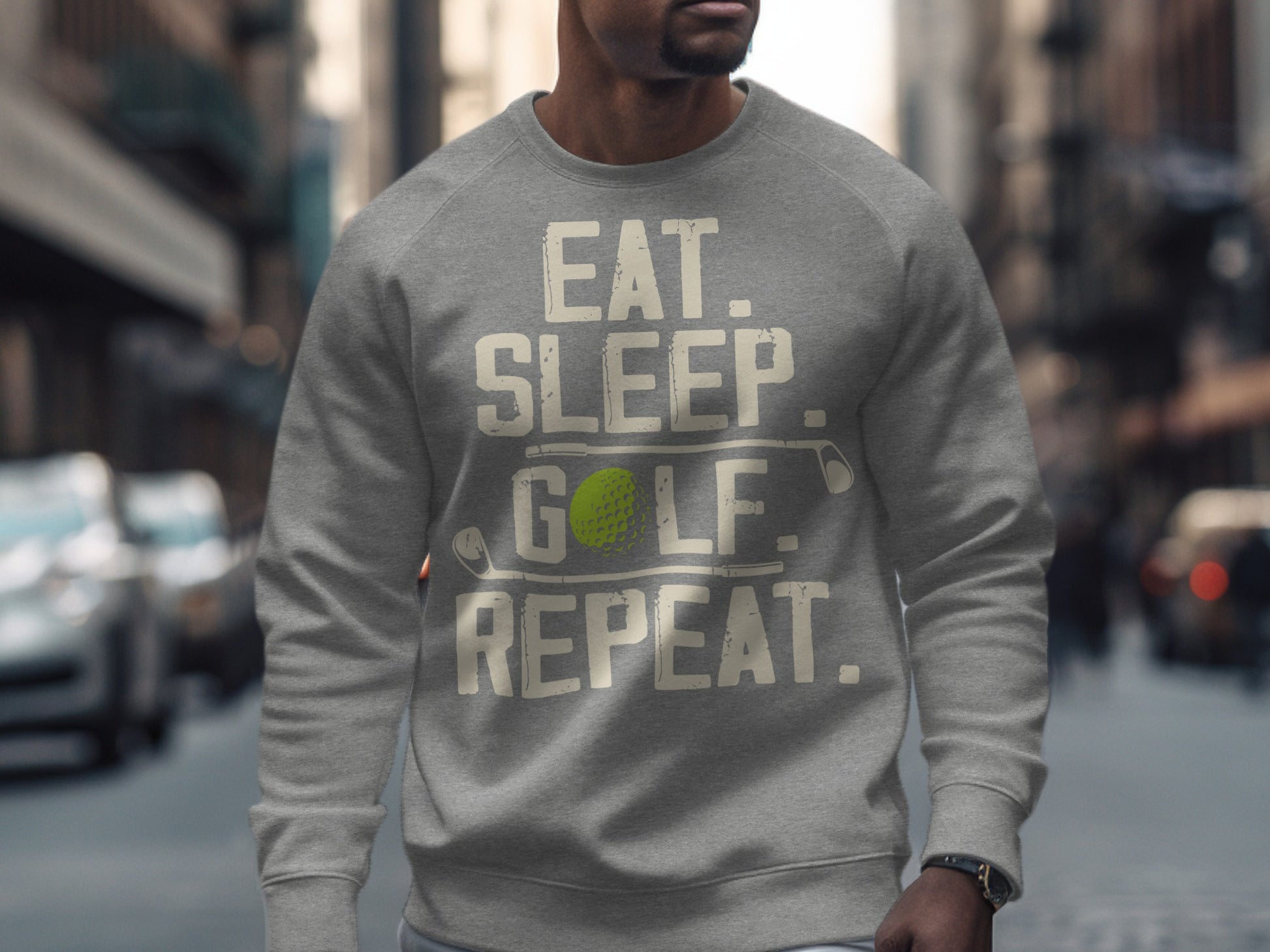 Gray sweatshirt with "Eat. Sleep. Golf. Repeat." text and a golf ball.