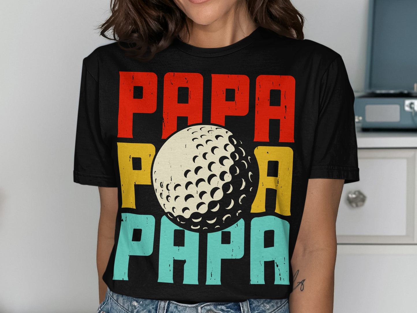 Black t-shirt with "PAPA" in red, yellow, and blue, and a golf ball graphic.