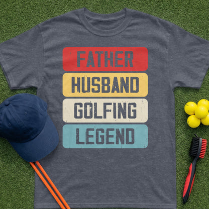 T-shirt reading "Father Husband Golfing Legend" on a grassy background.