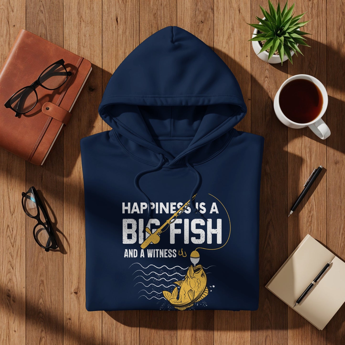 Navy hoodie with "Happiness is a big fish and a witness" fishing graphic.