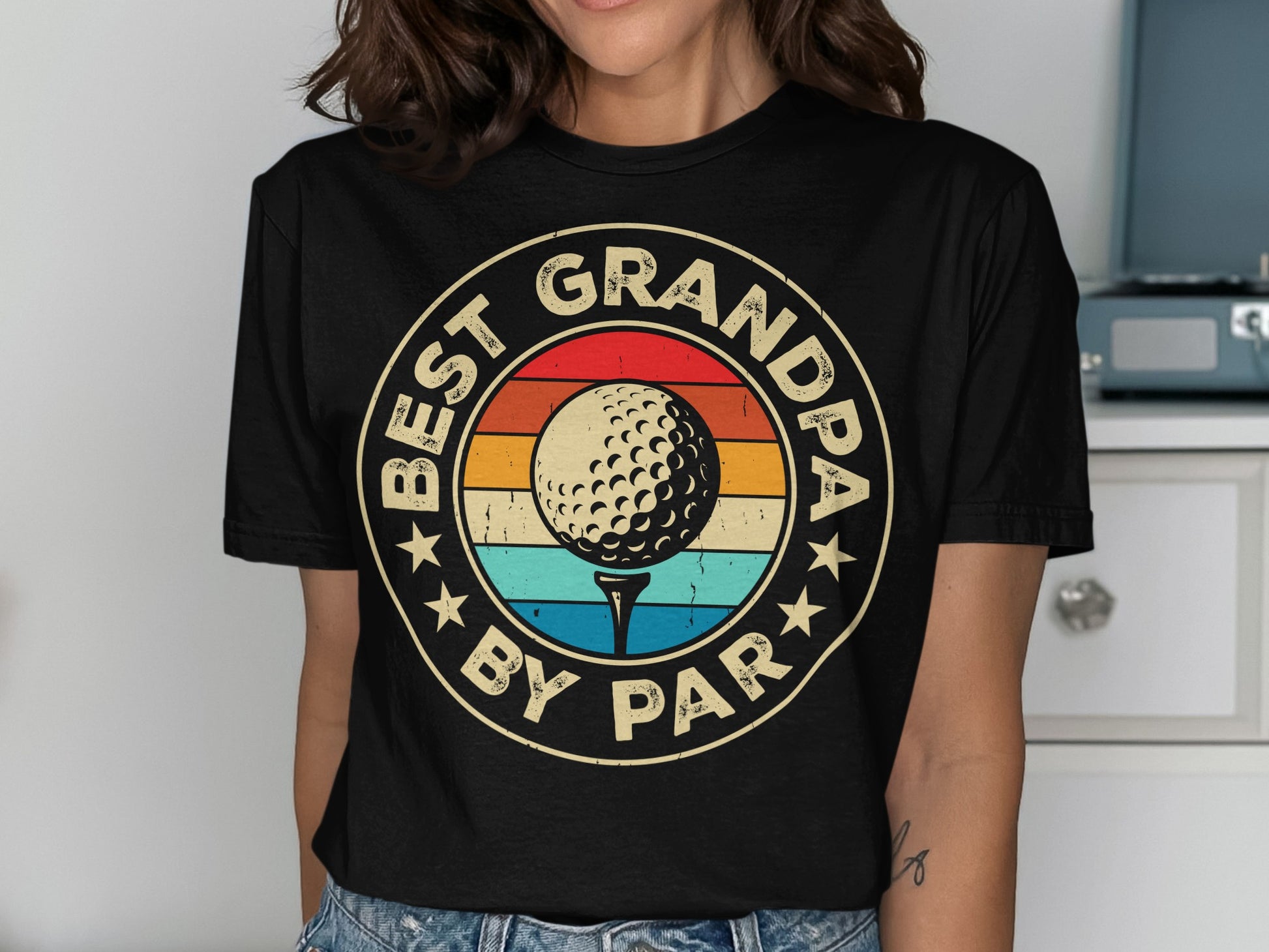 Circular graphic with golf ball, "BEST GRANDPA BY PAR" text, and sunset stripes.