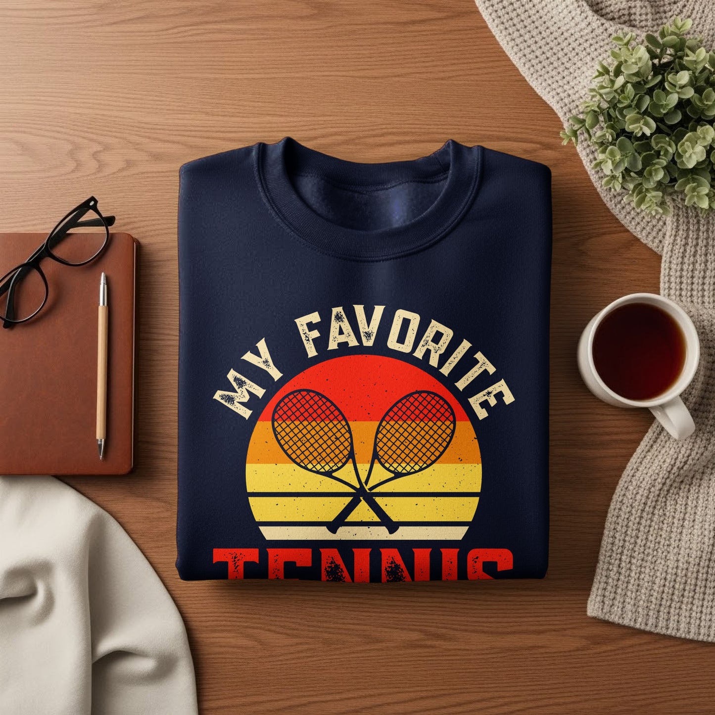 Navy sweatshirt with "MY FAVORITE TENNIS" and crossed rackets graphic.