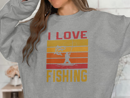 Grey sweatshirt with "I LOVE FISHING" text and sunset fishing graphic.