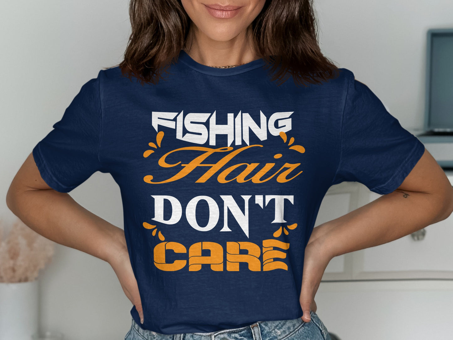 Navy t-shirt with white and orange text reading "FISHING HAIR DON'T CARE".
