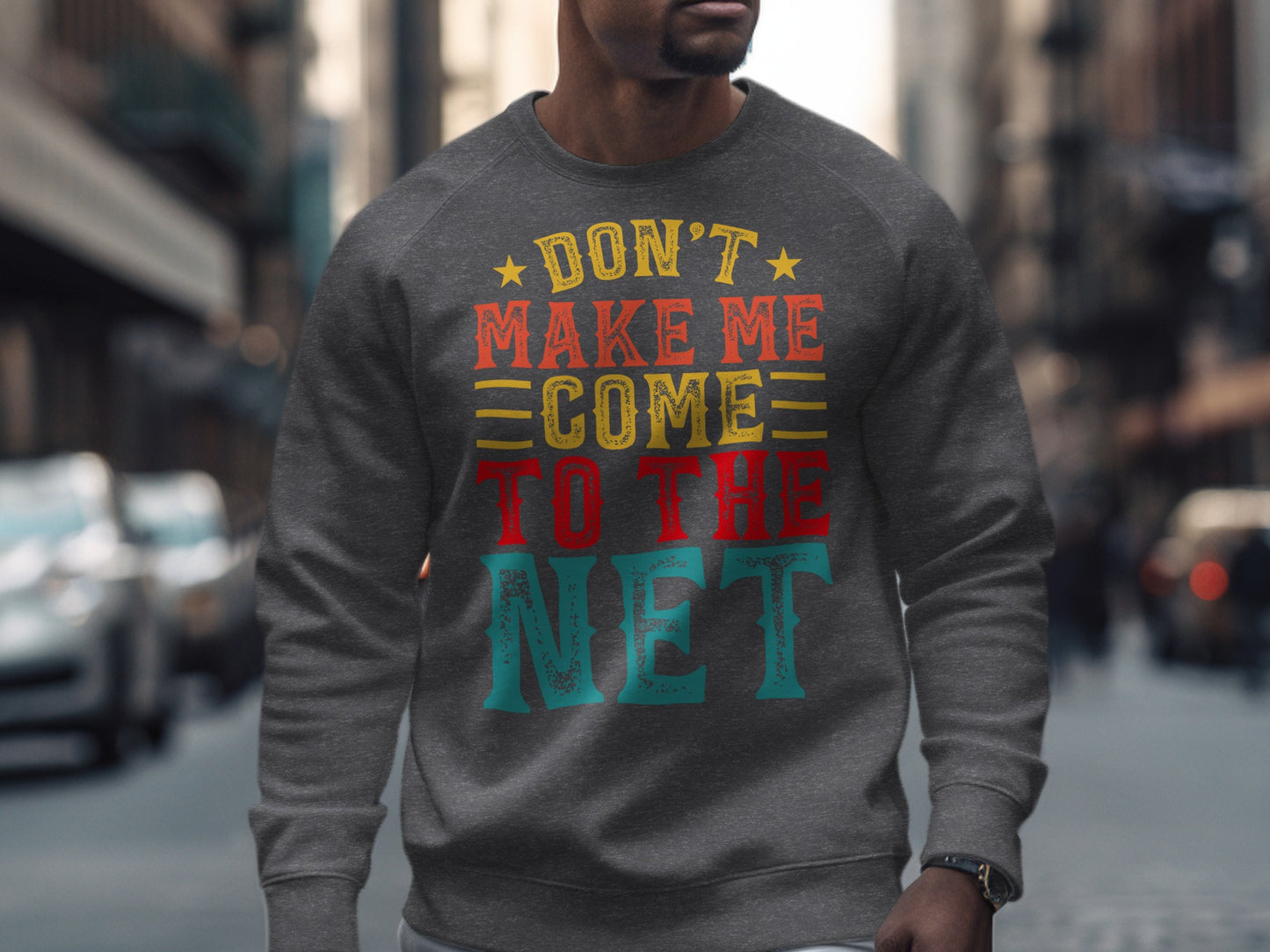 Gray sweatshirt with "Don't Make Me Come To The Net" in colorful text.