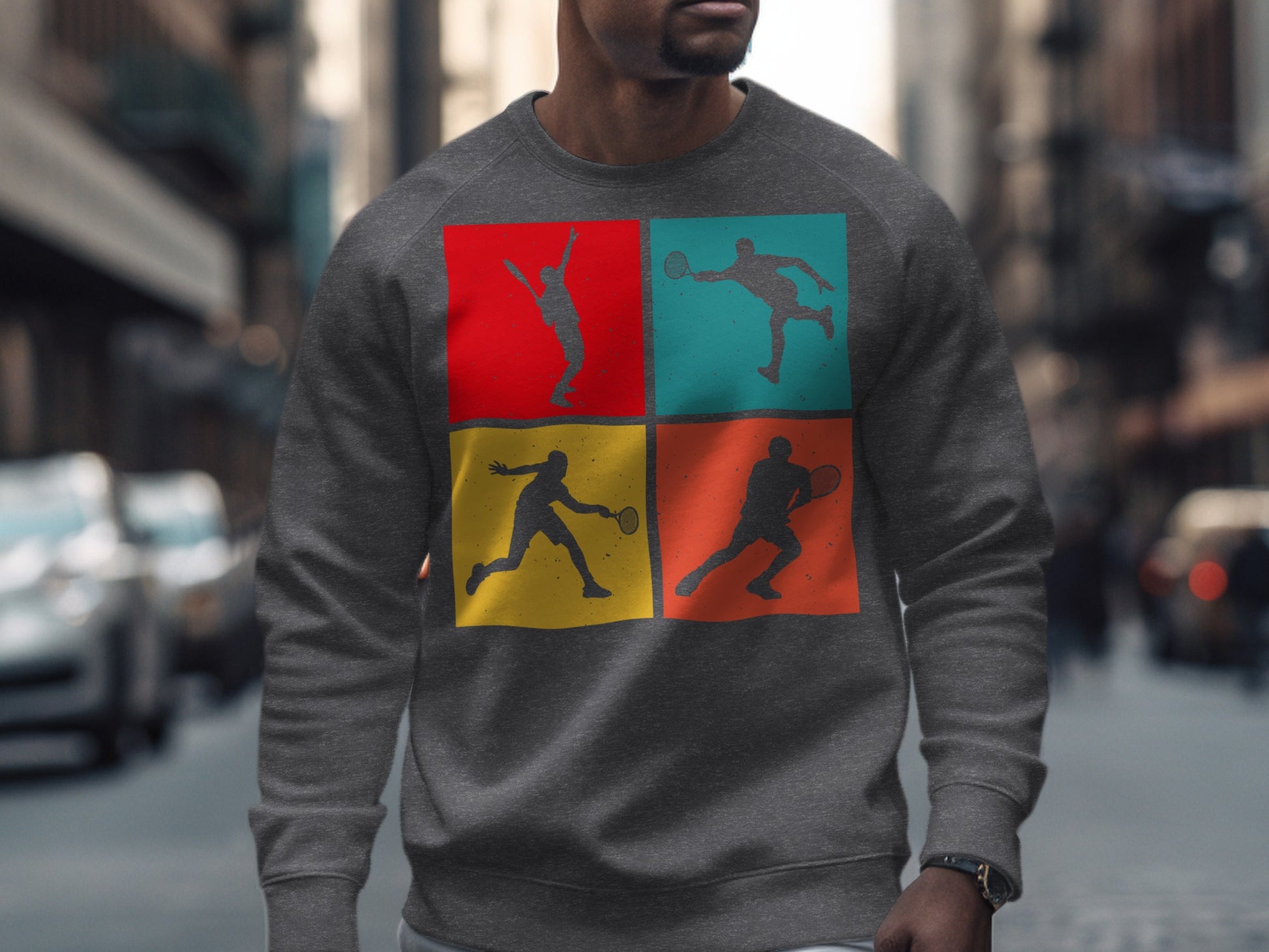 Gray sweatshirt with a four-panel graphic of tennis players in action.