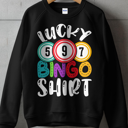 Black sweatshirt with "Lucky Bingo Shirt" text and colorful bingo balls.