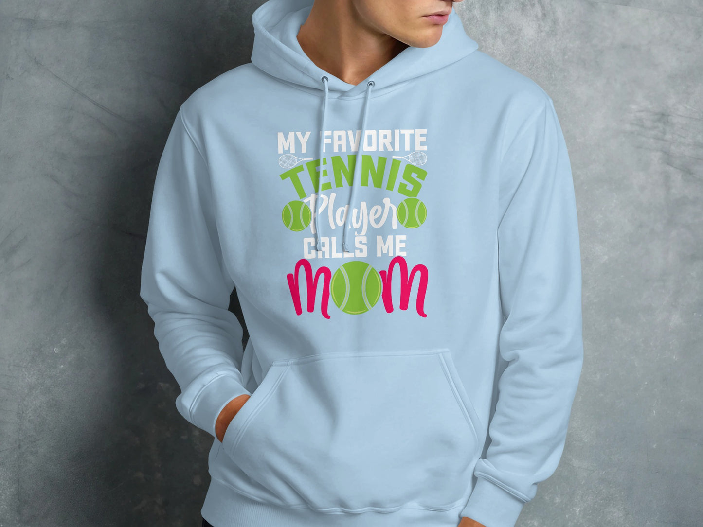 Light blue hoodie with "My Favorite Tennis Player Calls Me Mom" graphic.