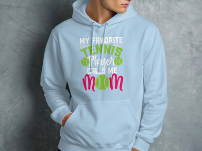 Light blue hoodie with "My Favorite Tennis Player Calls Me Mom" graphic.