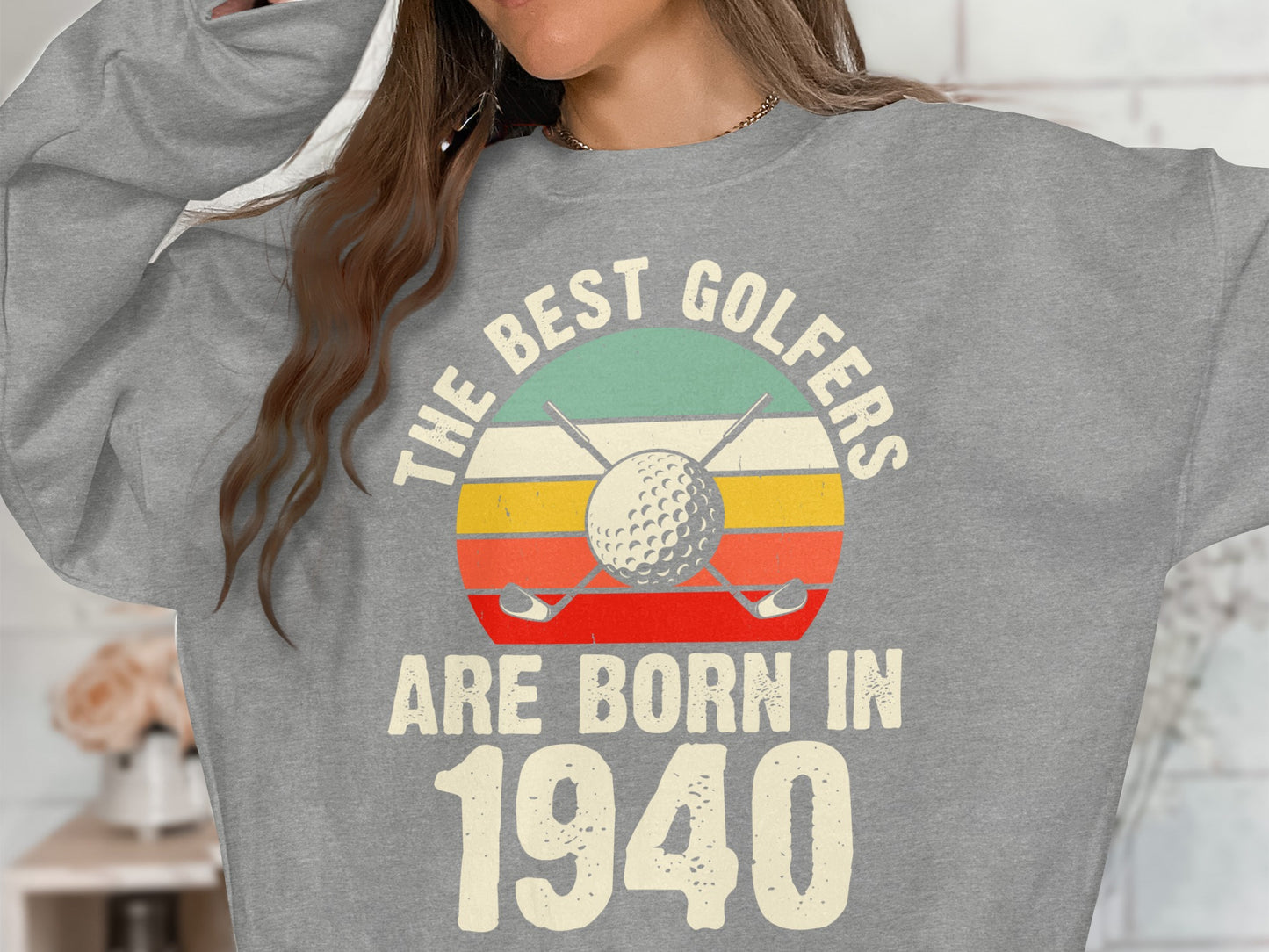 Sweatshirt with "The Best Golfers Are Born In 1940" and golf imagery.