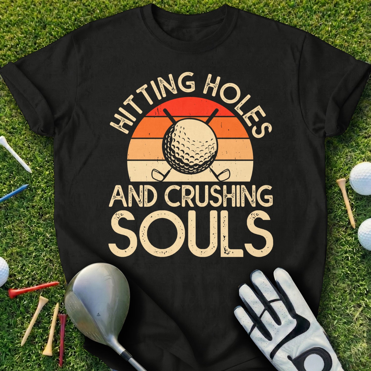 T-shirt with "Hitting Holes And Crushing Souls" and golf imagery.