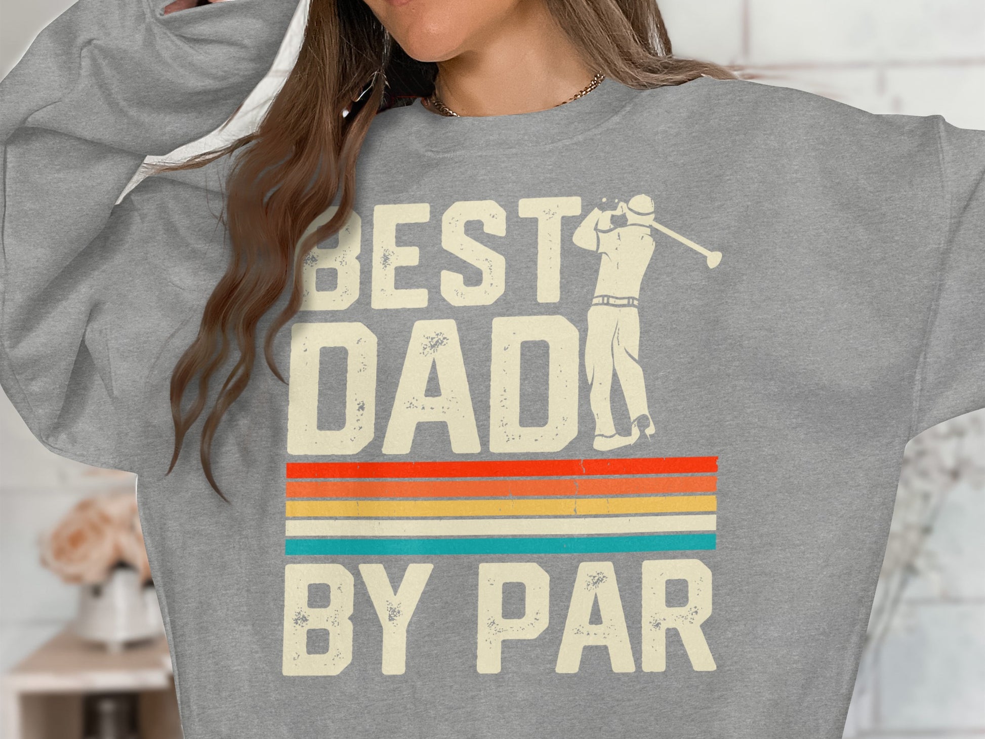 Gray sweatshirt with "BEST DAD BY PAR" text and vintage stripes.