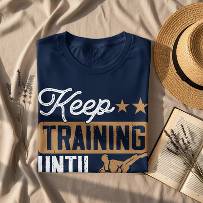 Navy t-shirt with "Keep TRAINING" in white and gold text, featuring a martial artist.