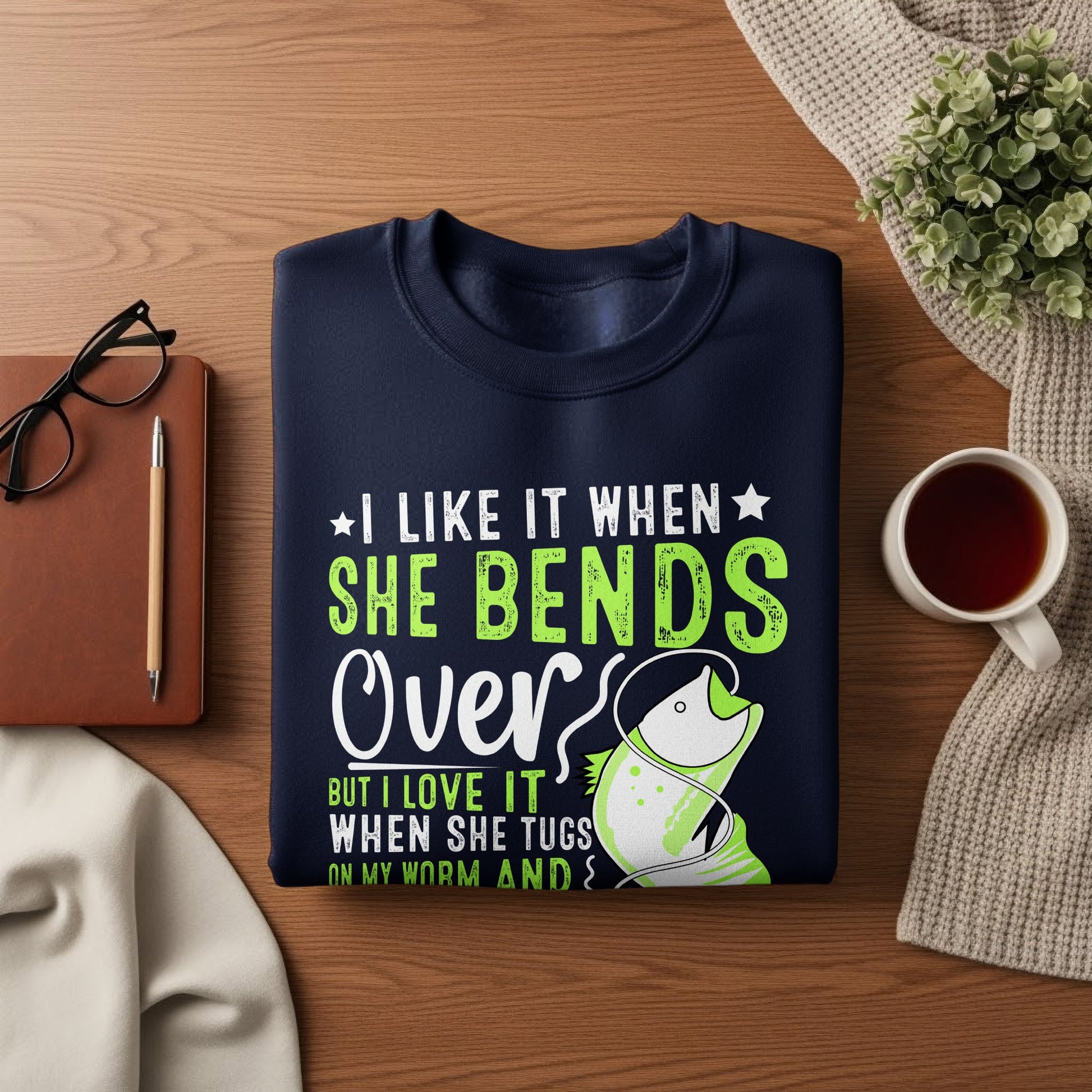 Navy sweatshirt with text "I like it when she bends over but I love it when she tugs on my worm."