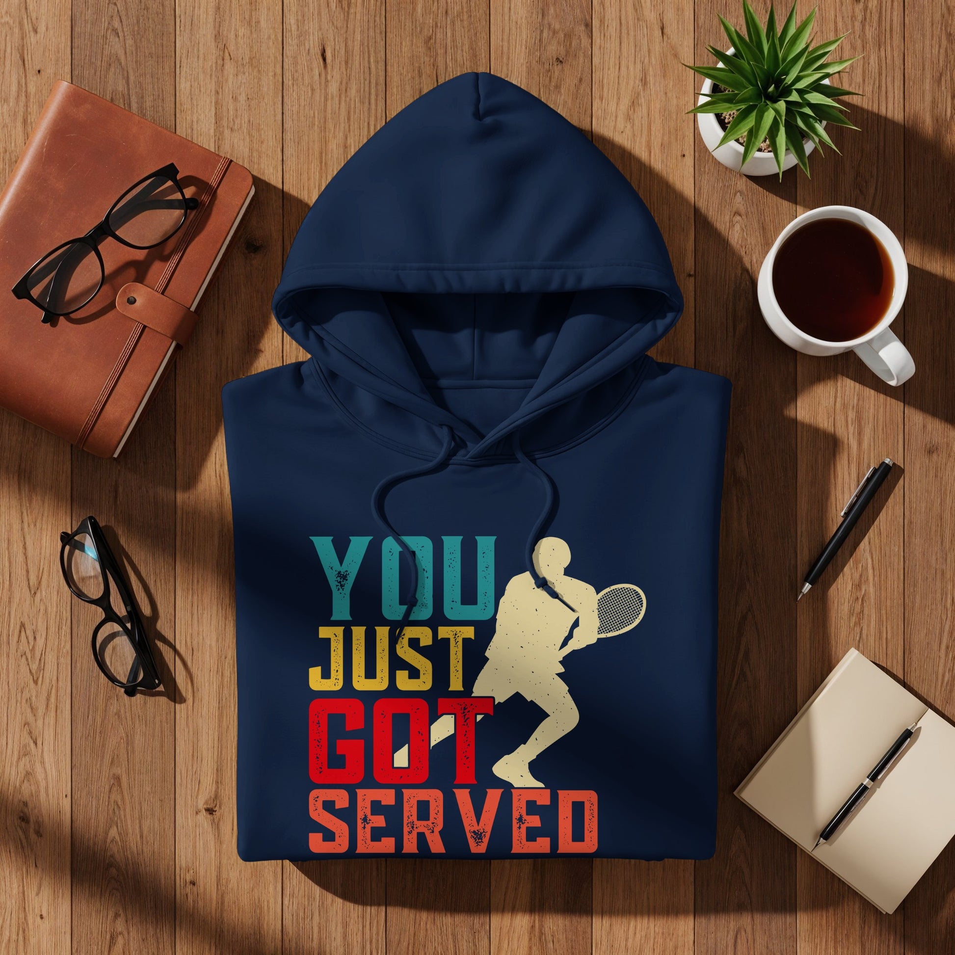 Navy hoodie with graphic text and tennis player: "YOU JUST GOT SERVED."