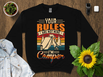 Black sweatshirt with "Your Rules Are Not Mine I'm a Camper" text and camping graphic.