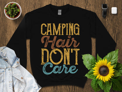 Black sweatshirt with "CAMPING HAIR DON'T CARE" text in distressed font.