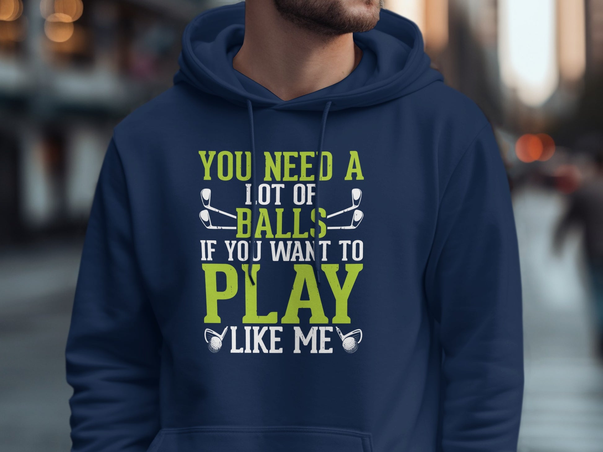 Navy hoodie with "You need a lot of balls if you want to play like me" text and golf clubs.