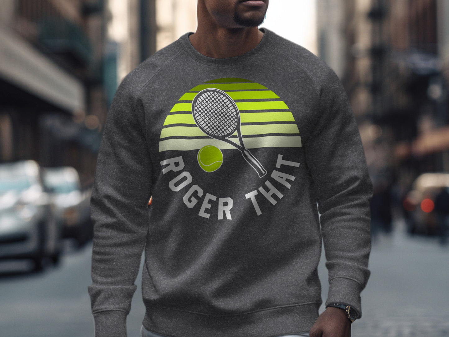 Gray sweatshirt with "ROGER THAT" text and tennis racket and ball graphic.