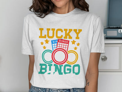 White t-shirt with "LUCKY BINGO" and bingo card graphics.