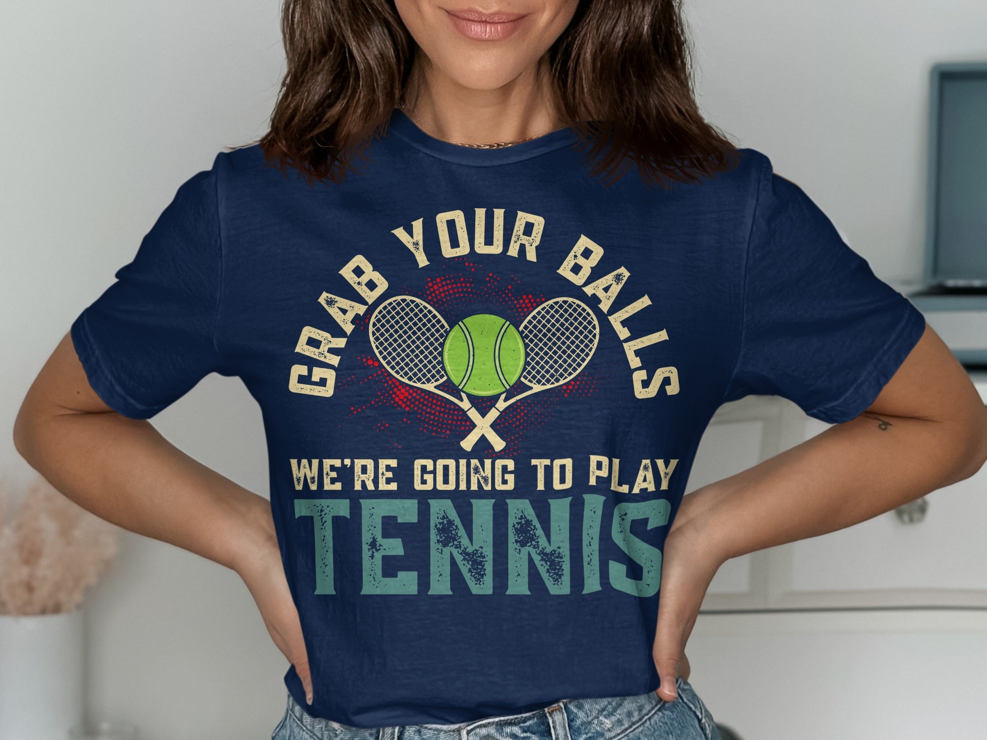 Navy t-shirt with "GRAB YOUR BALLS WE'RE GOING TO PLAY TENNIS" and crossed rackets.
