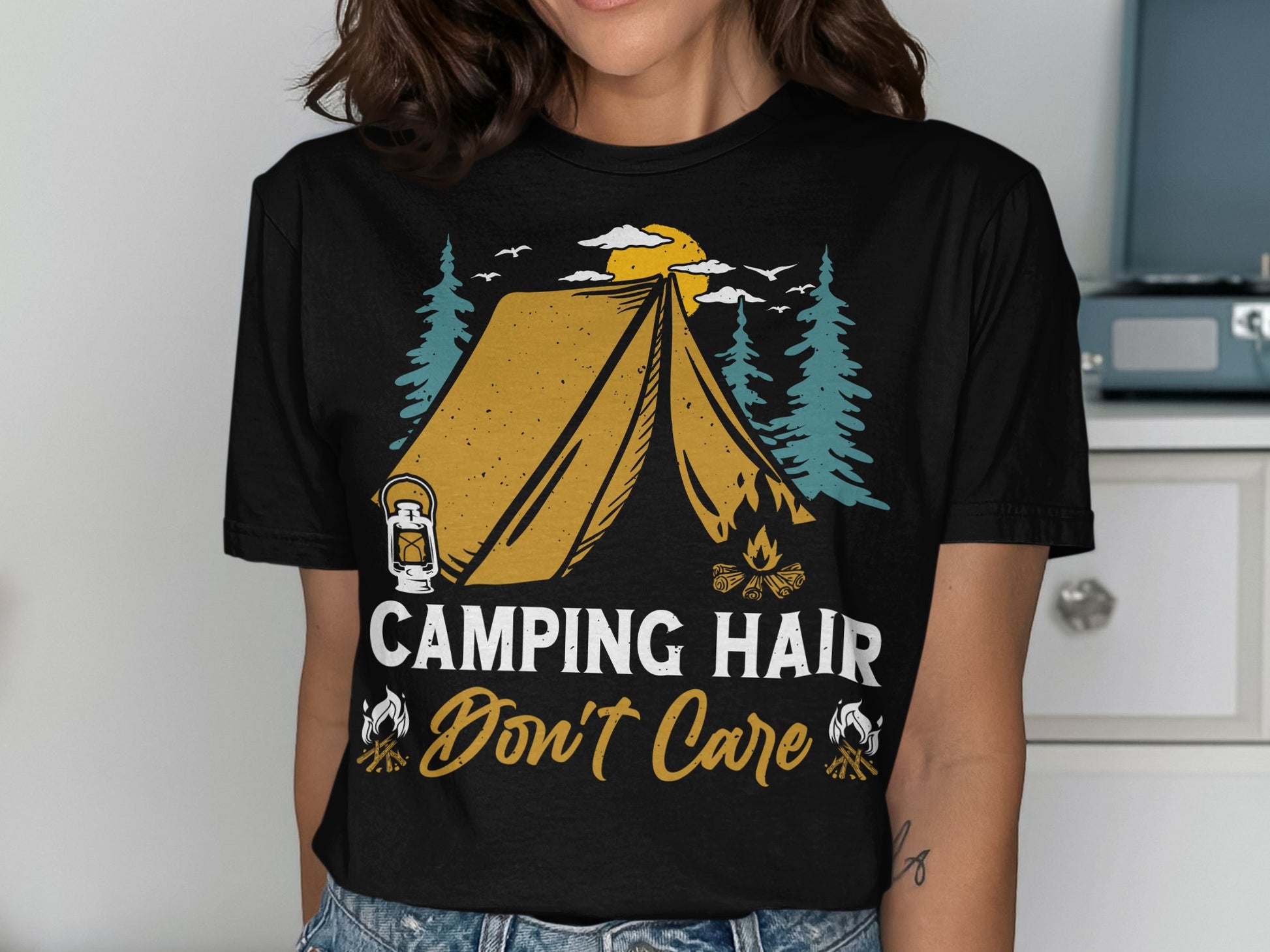 Black t-shirt with "Camping Hair Don't Care" text and tent graphic.