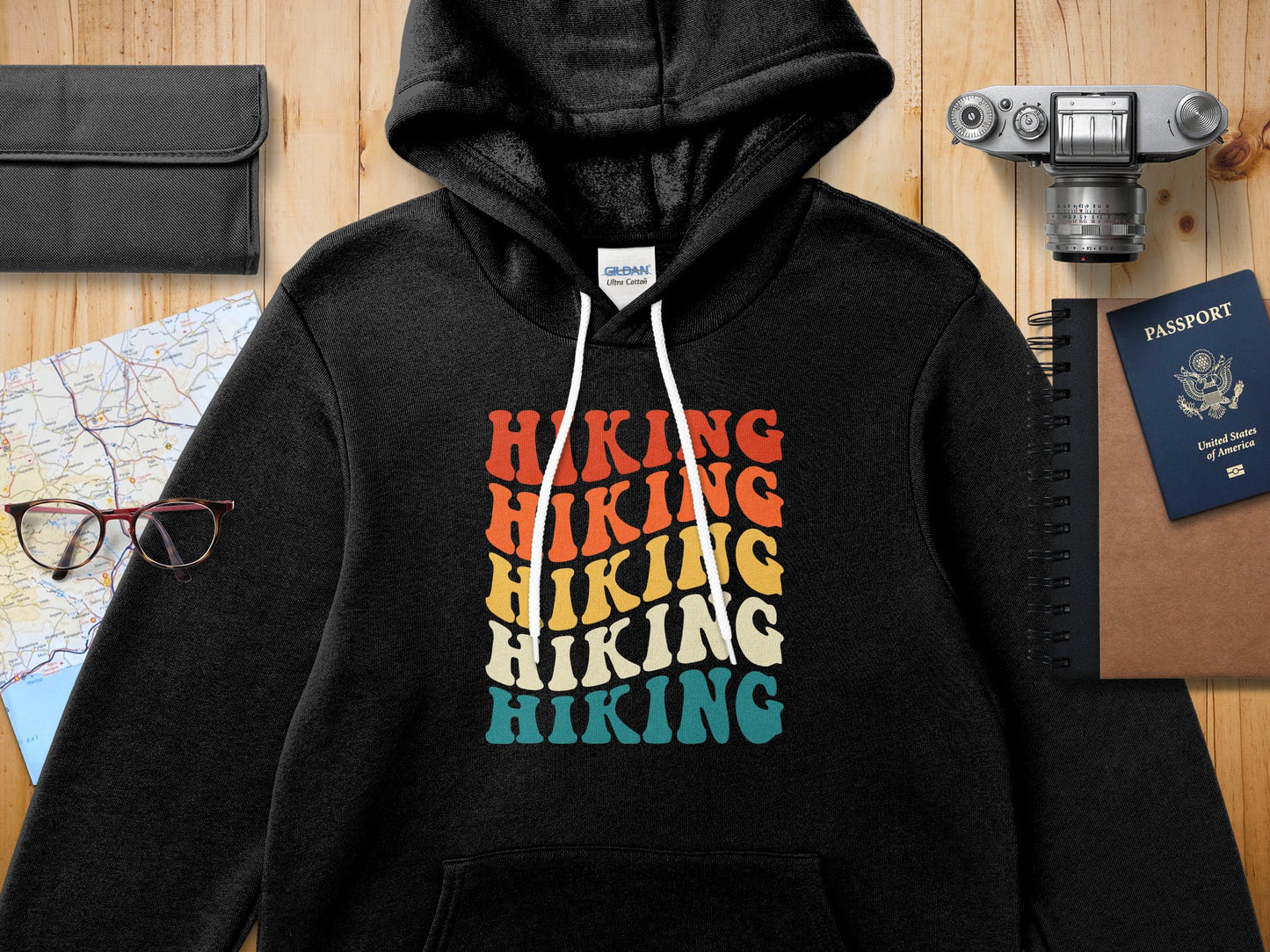 Black hoodie with "Hiking" text in colorful retro block letters.