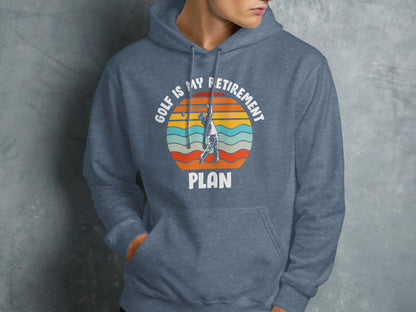 Gray hoodie with "GOLF IS MY RETIREMENT PLAN" text and sunset golf graphic.