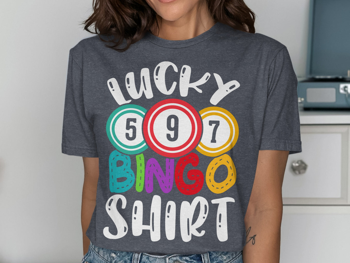Dark grey t-shirt with "LUCKY BINGO SHIRT" in colorful letters and numbers.