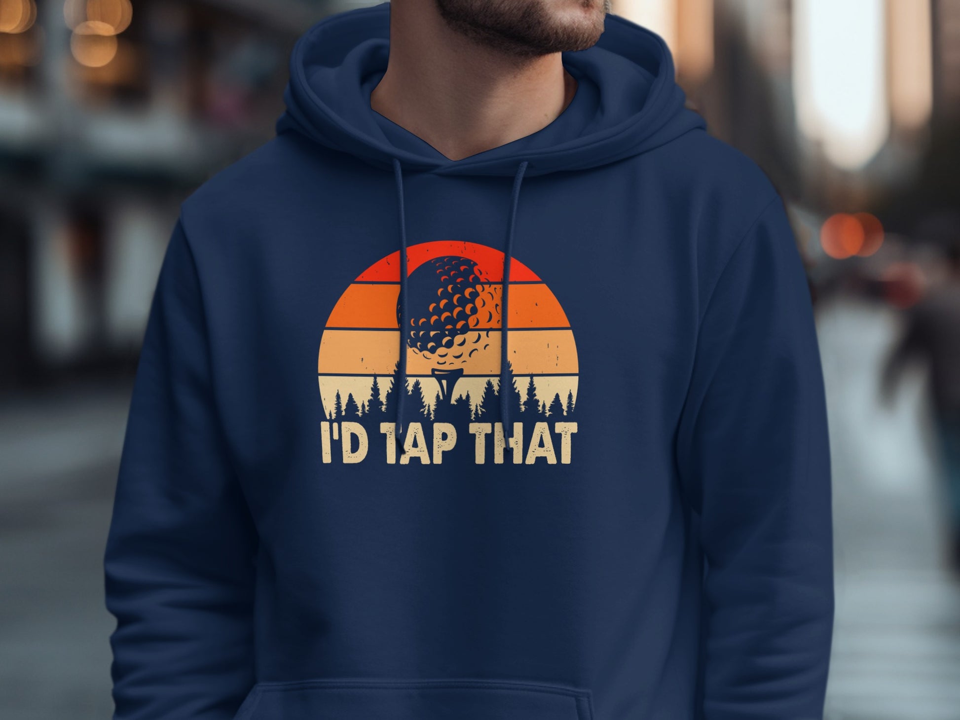 Navy hoodie with a sunset graphic featuring a golf ball and trees.