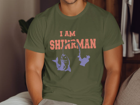 Olive t-shirt with "I AM SHINJIRUMAN" and fishing graphics.