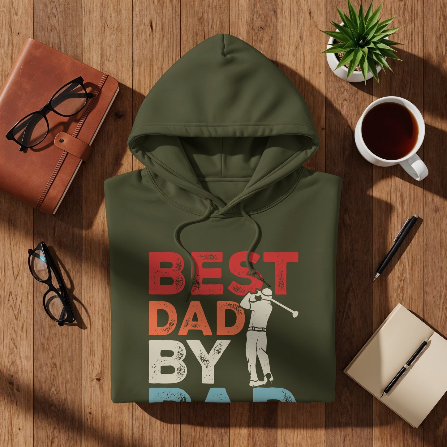 Olive green hoodie with "BEST DAD BY PAR" text and a golfer graphic.