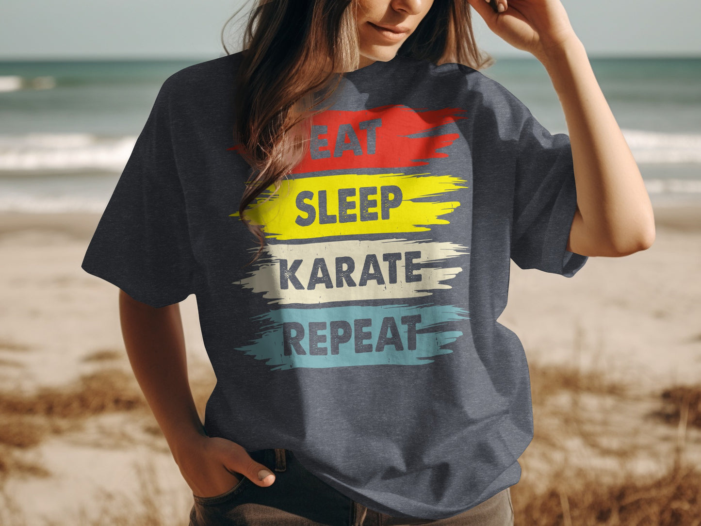 Dark t-shirt with "EAT SLEEP KARATE REPEAT" text in bold, colorful brush strokes.