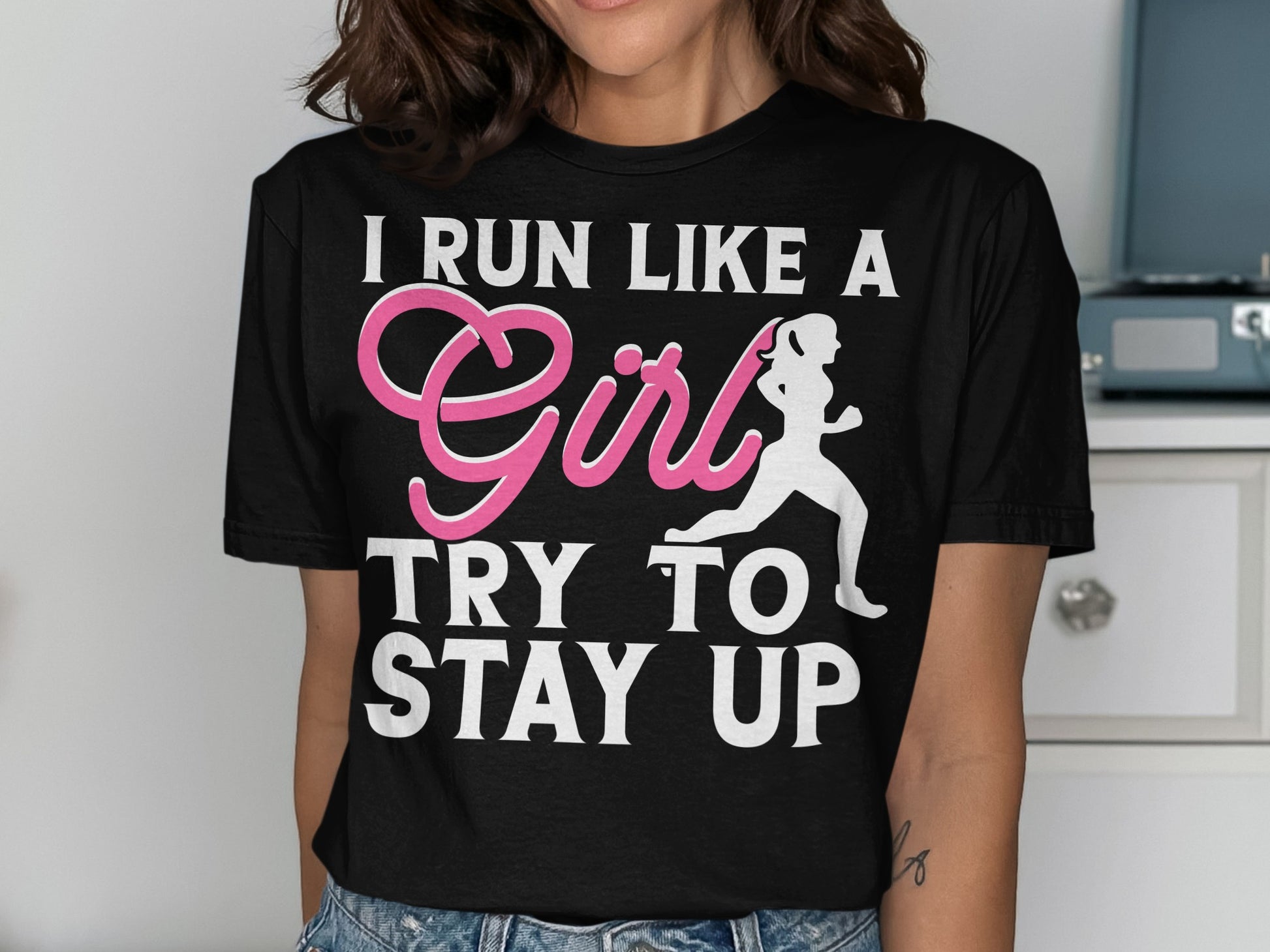 Black t-shirt with pink text and a running silhouette: "I RUN LIKE A Girl TRY TO STAY UP"