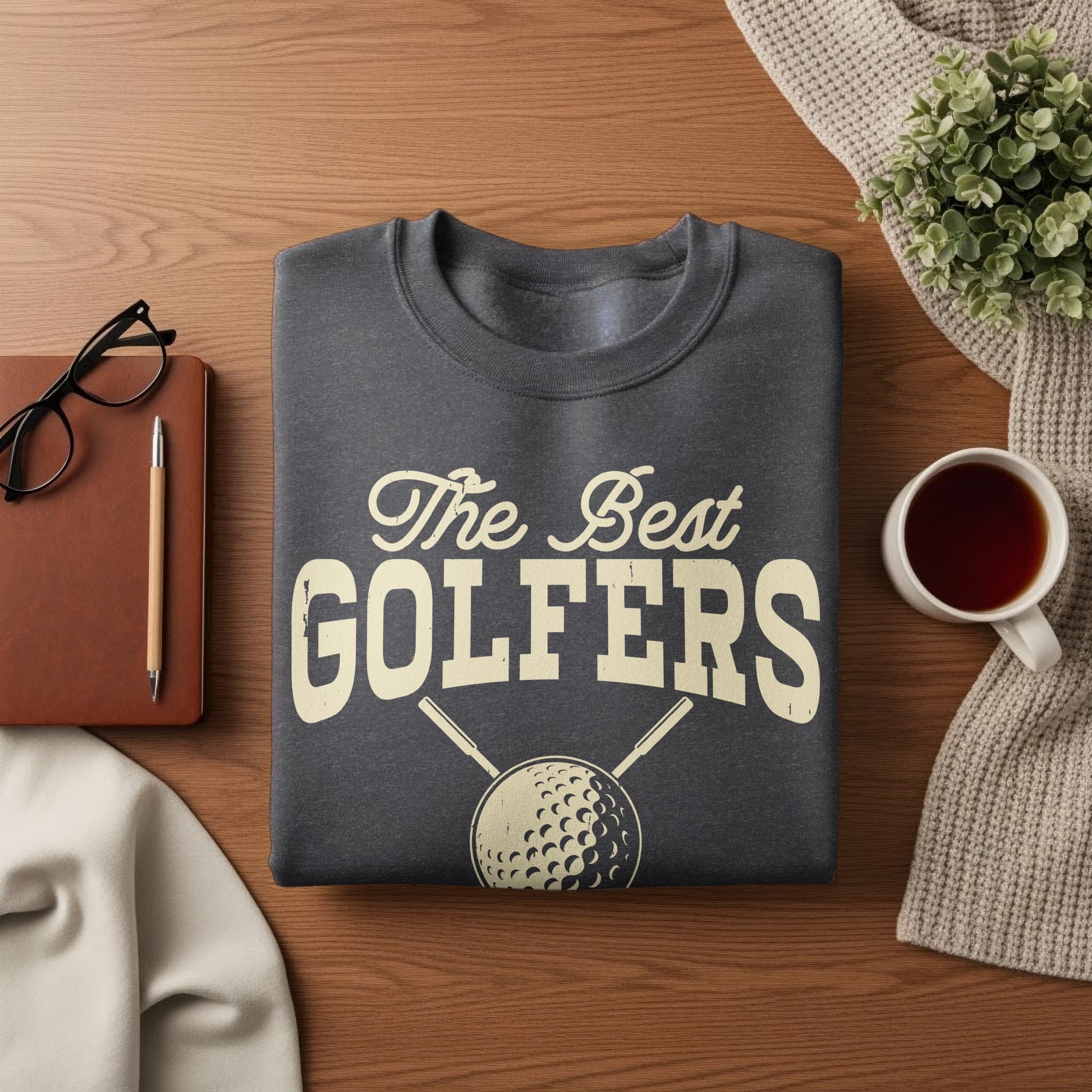 Dark gray sweatshirt with "The Best Golfers" text and golf ball graphic.
