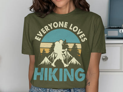 Olive green t-shirt with "EVERYONE LOVES HIKING" and mountain graphic.
