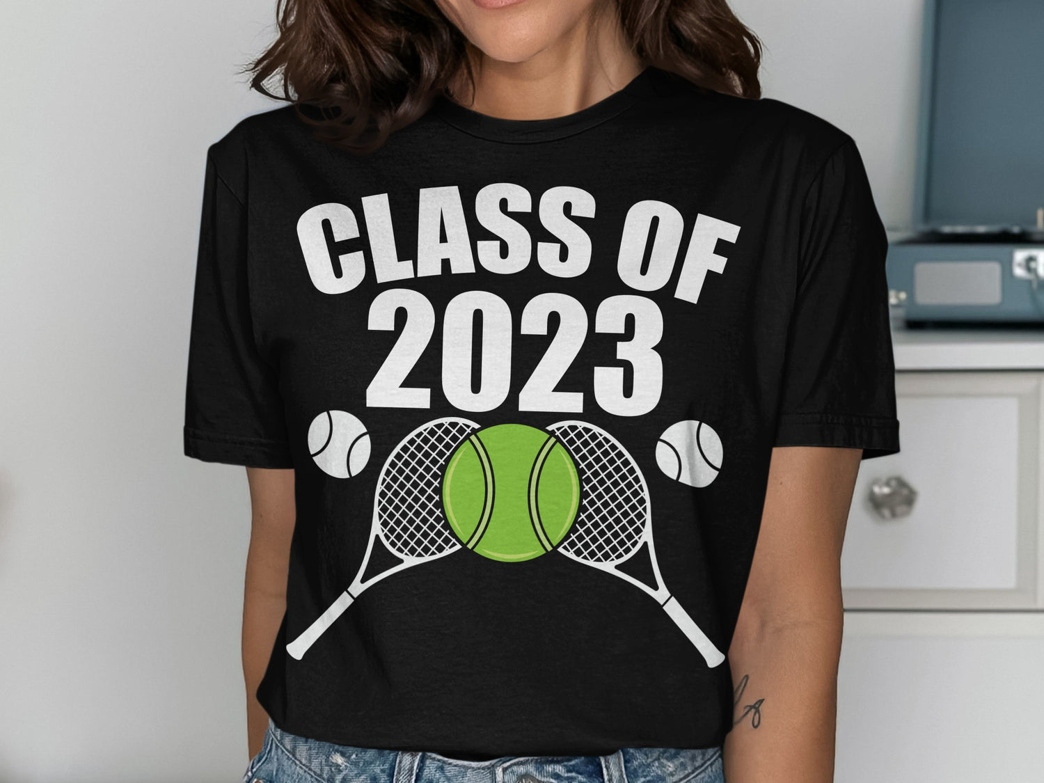 Black t-shirt with "CLASS OF 2023" text and tennis rackets and balls.