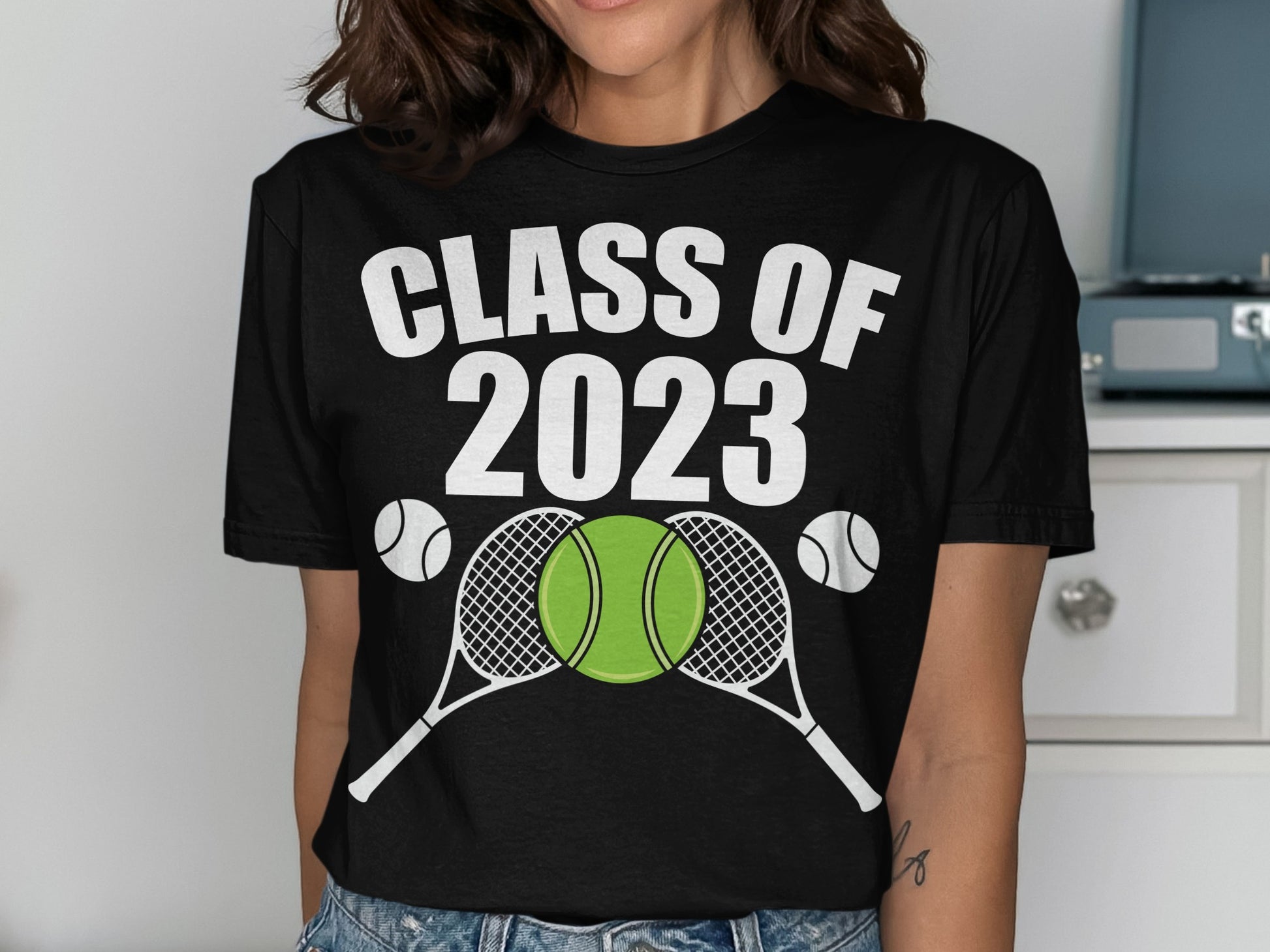 Black t-shirt with "CLASS OF 2023" text and tennis rackets and balls.