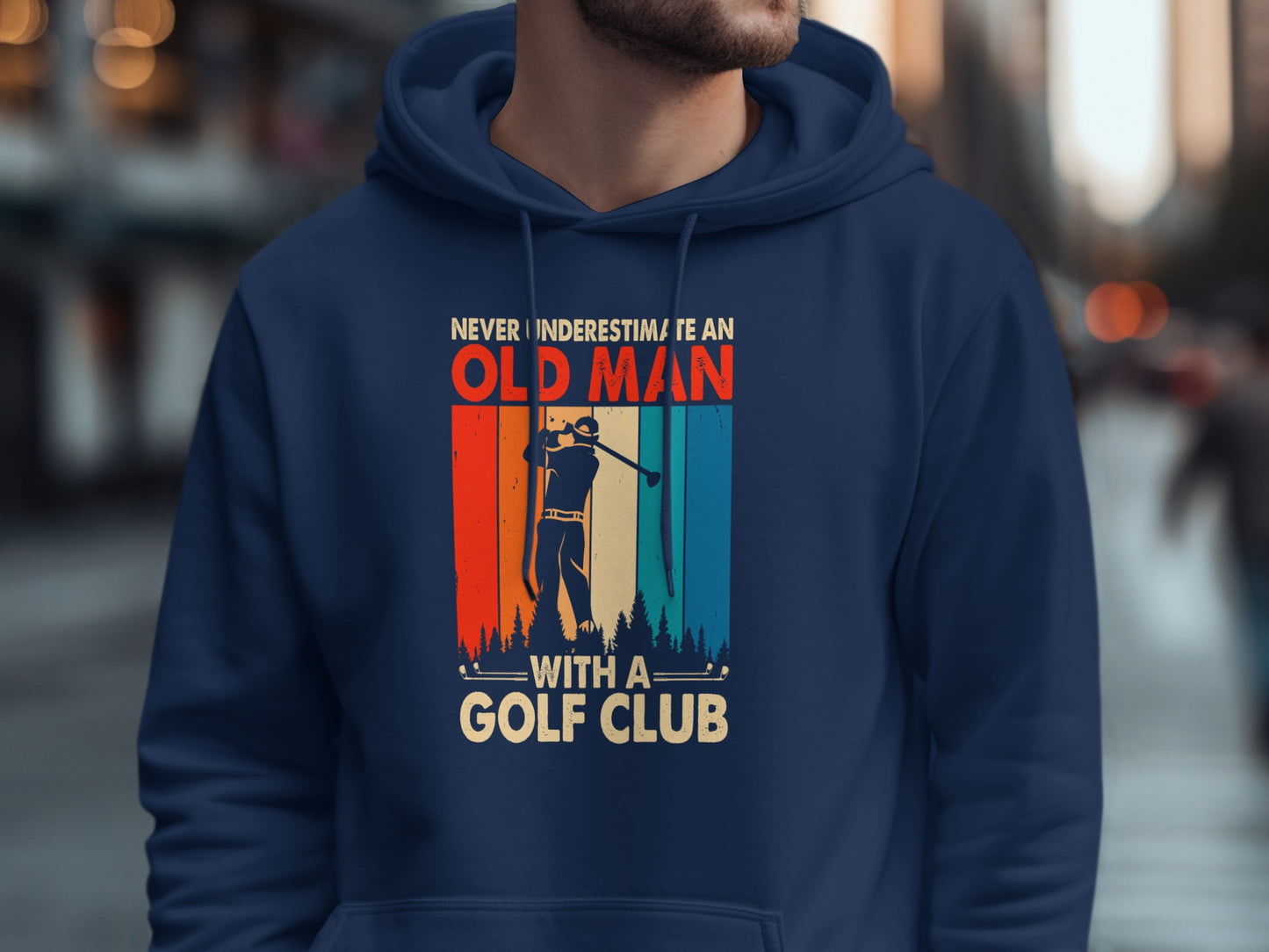 Navy hoodie featuring "Never Underestimate an Old Man with a Golf Club" graphic.