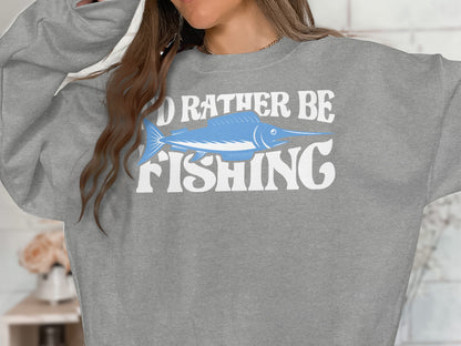 Gray sweatshirt with "I'd Rather Be Fishing" and a marlin graphic.