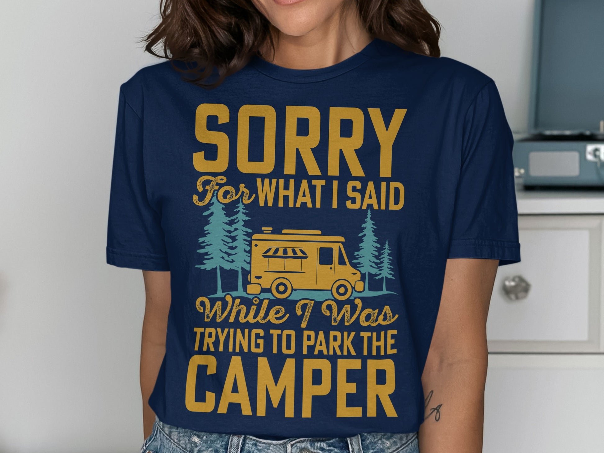 Navy t-shirt with "Sorry For What I Said While I Was Trying To Park The Camper" text and camper graphic.