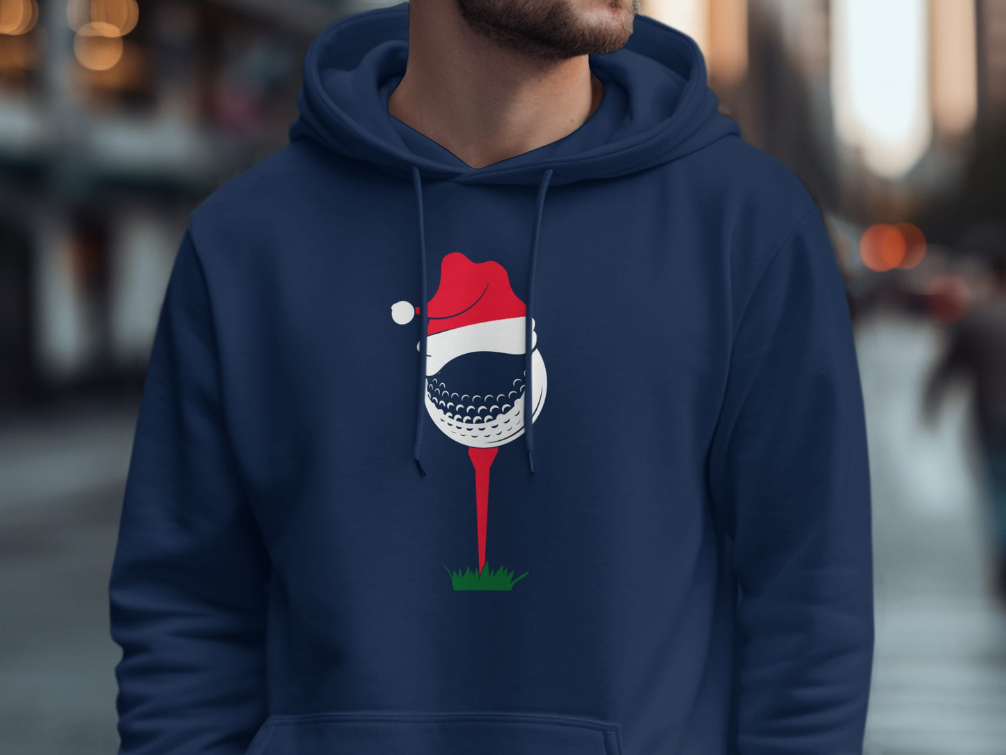 Navy blue hoodie with a golf ball wearing a Santa hat on a tee.