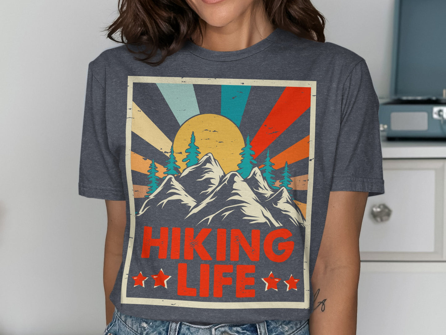 Graphic tee with mountains, trees, sunburst, and "Hiking Life" text.