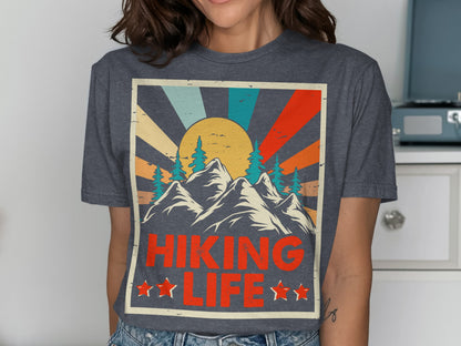 Graphic tee with mountains, trees, sunburst, and "Hiking Life" text.