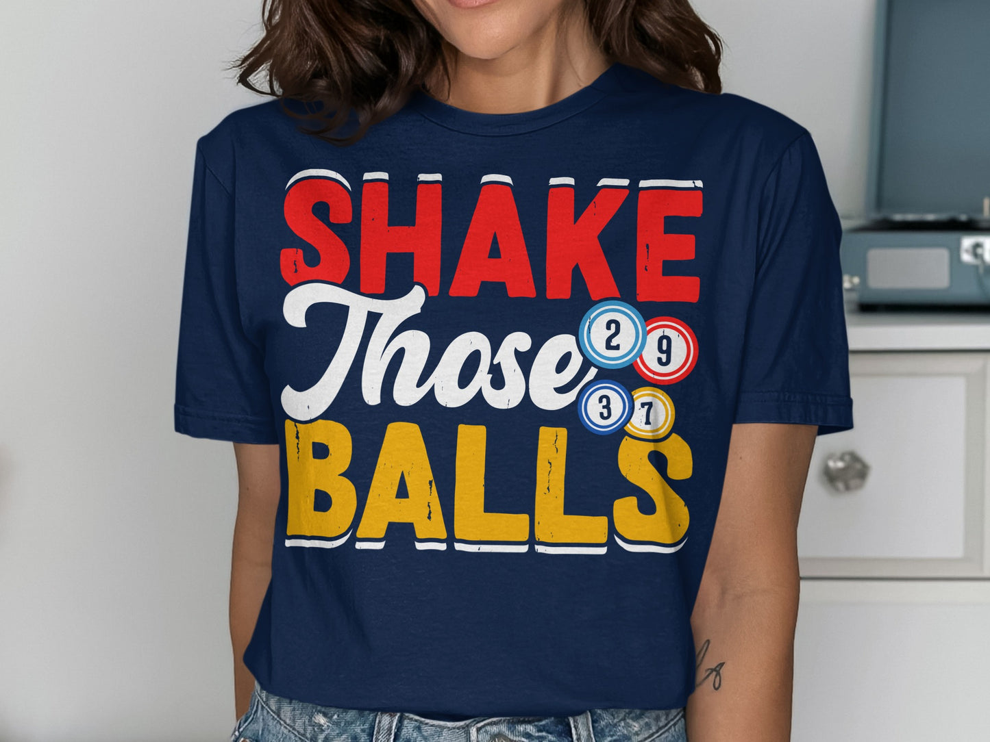 Navy t-shirt with "SHAKE Those BALLS" and bingo balls.