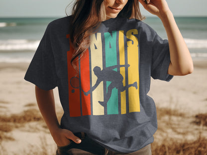 T-shirt featuring a silhouette of a tennis player on a beach background.
