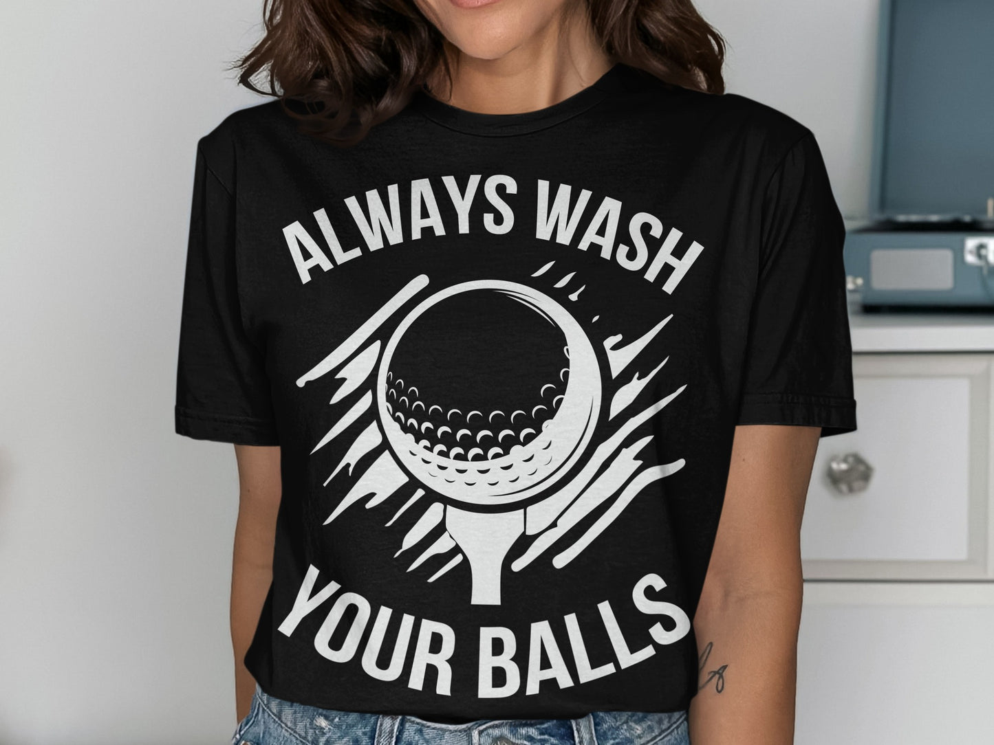 Black t-shirt with golf ball graphic and text "ALWAYS WASH YOUR BALLS".
