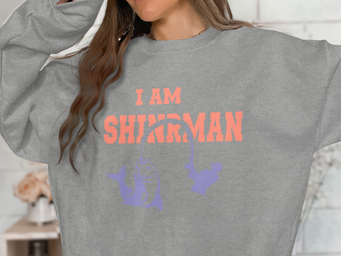 Grey sweatshirt with "I AM SHARKMAN" text and fishing shark graphic.